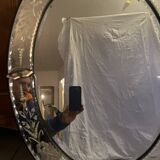 Oval Venetian mirror with close-bezel, early 20th century, flower decoration