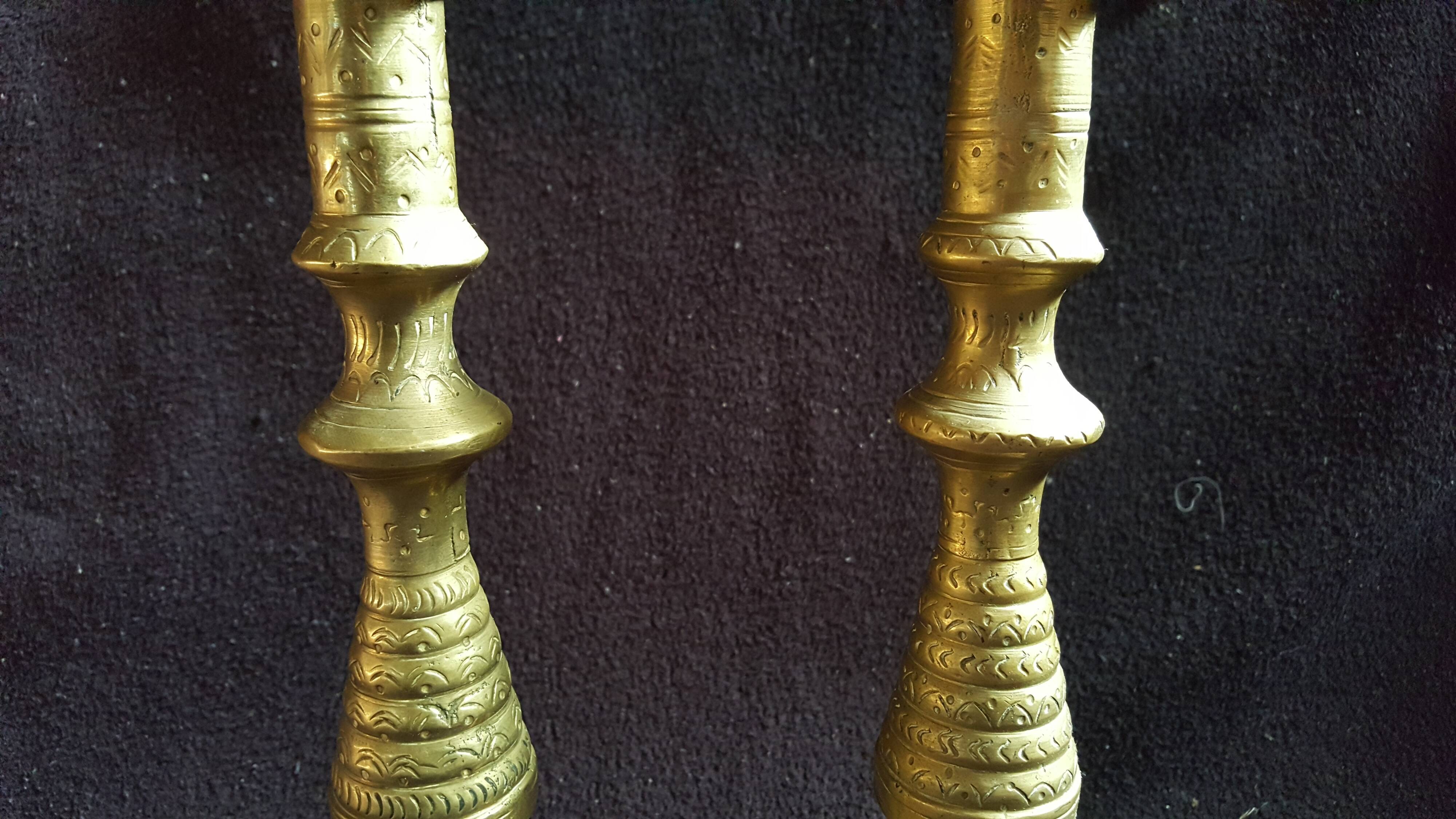 Former pair of bronze candlesticks