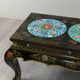 Black lacquered wooden coffee table with cloisonné and polychrome decoration, 20th century.