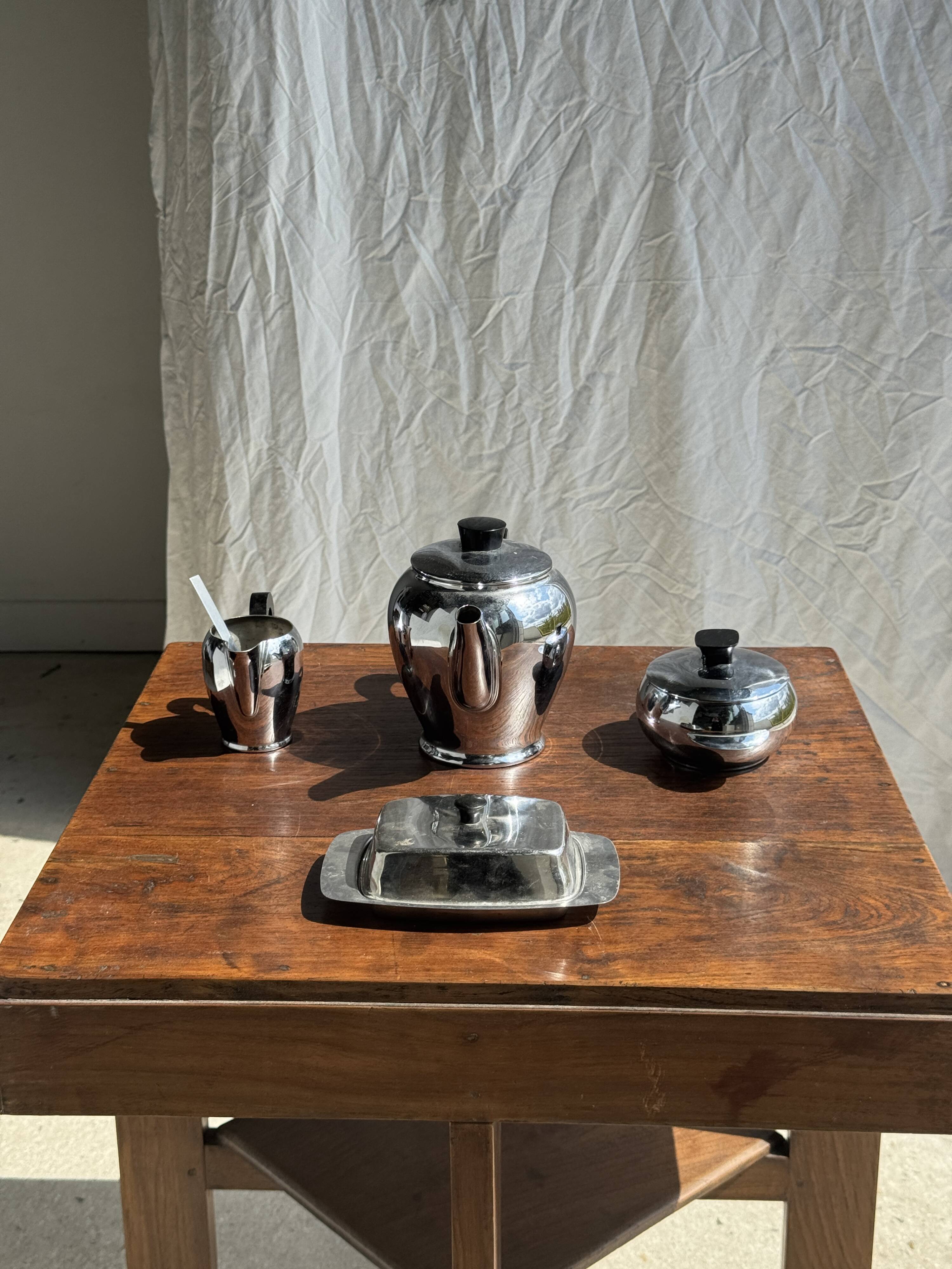 Tea set including teapot, milk jug, sugar bowl and butter dish