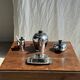 Tea set including teapot, milk jug, sugar bowl and butter dish