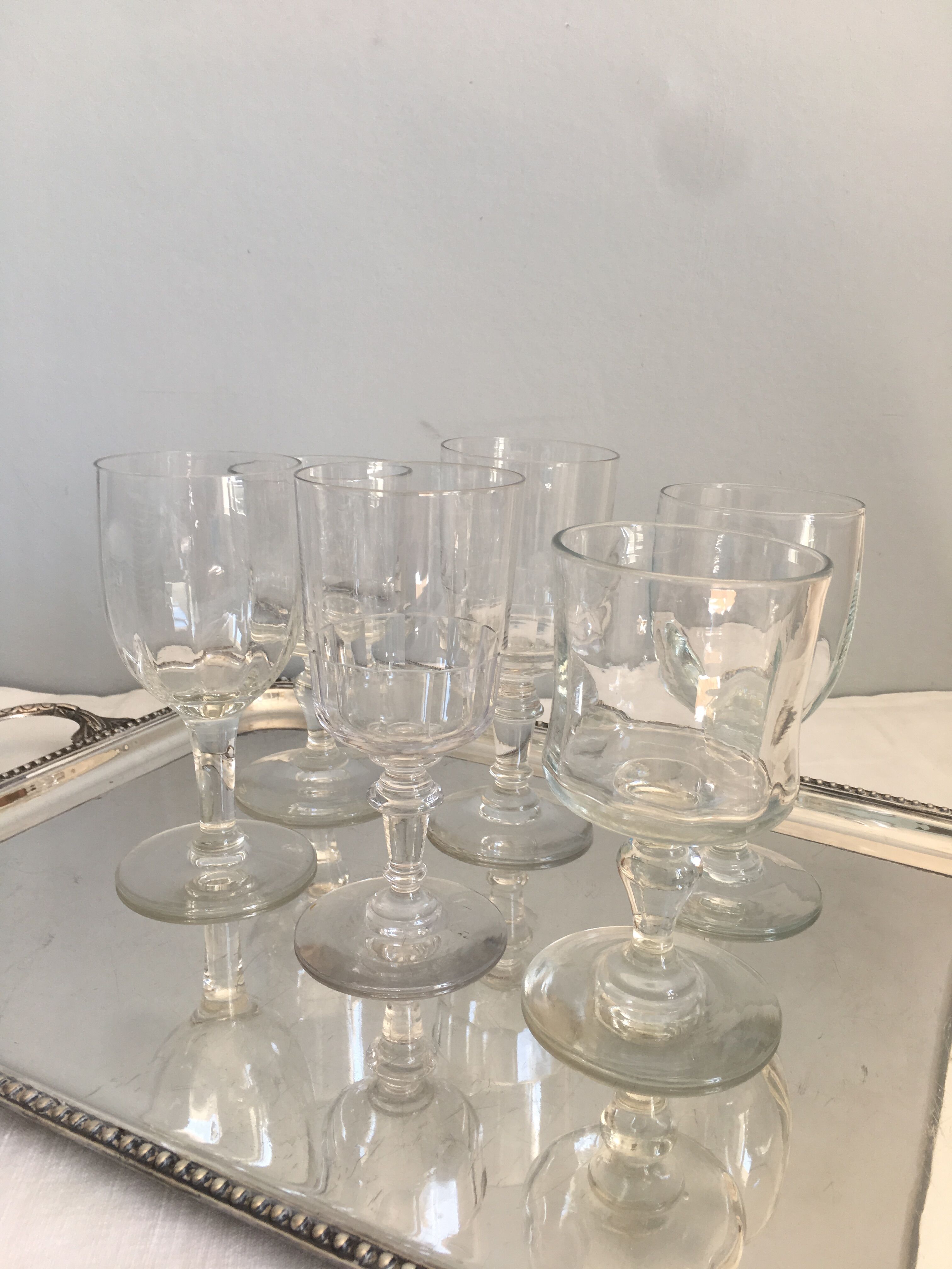 6 old mismatched water glasses