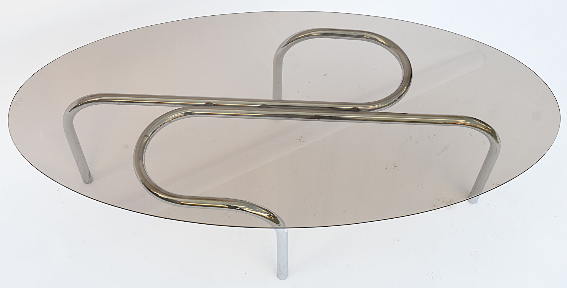 Coffee table in chromed metal and glass
