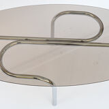Coffee table in chromed metal and glass