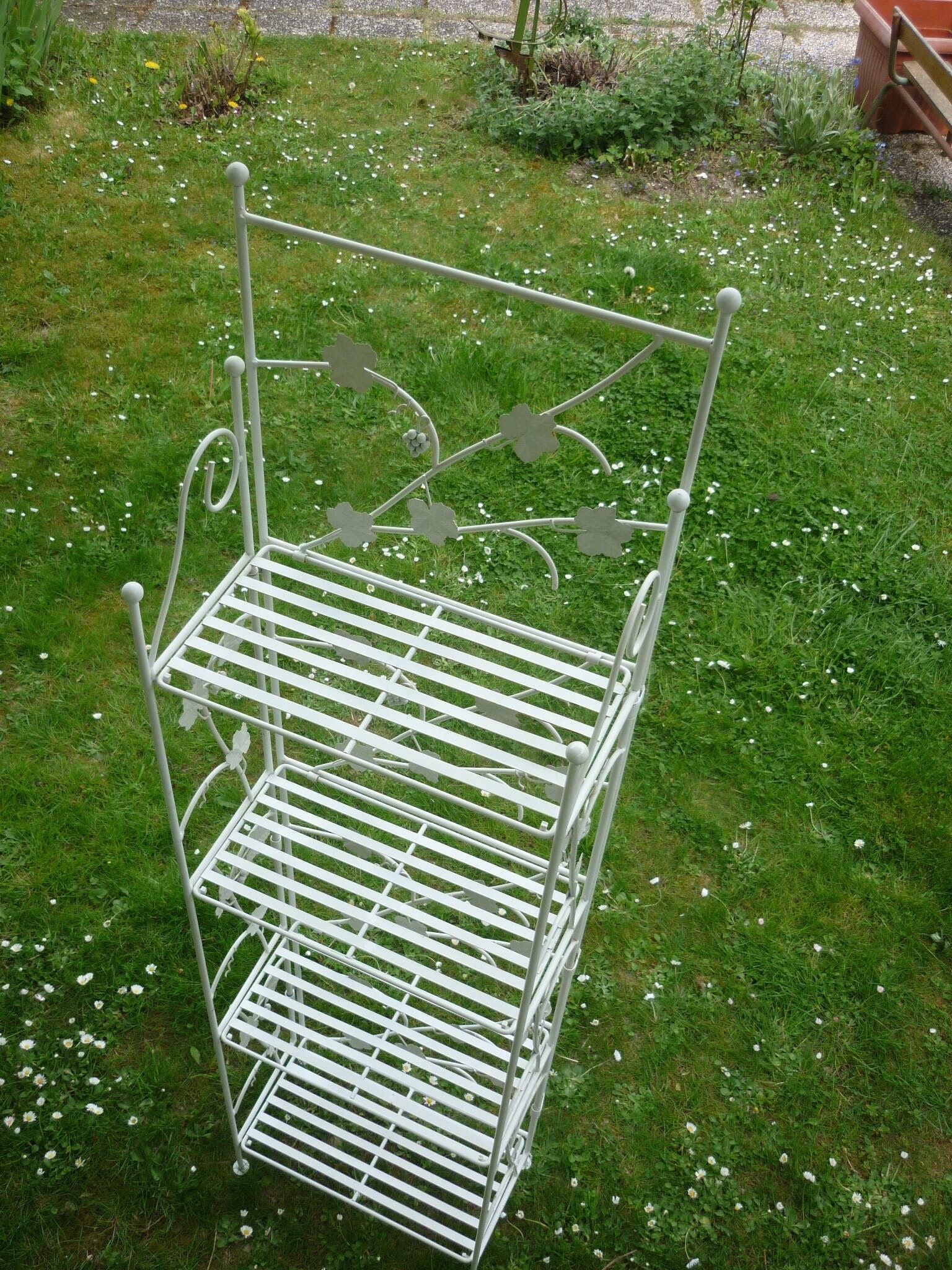 Folding white wrought iron shelf
