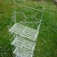 Folding white wrought iron shelf