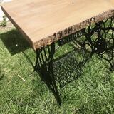 Cast iron and solid wood side table