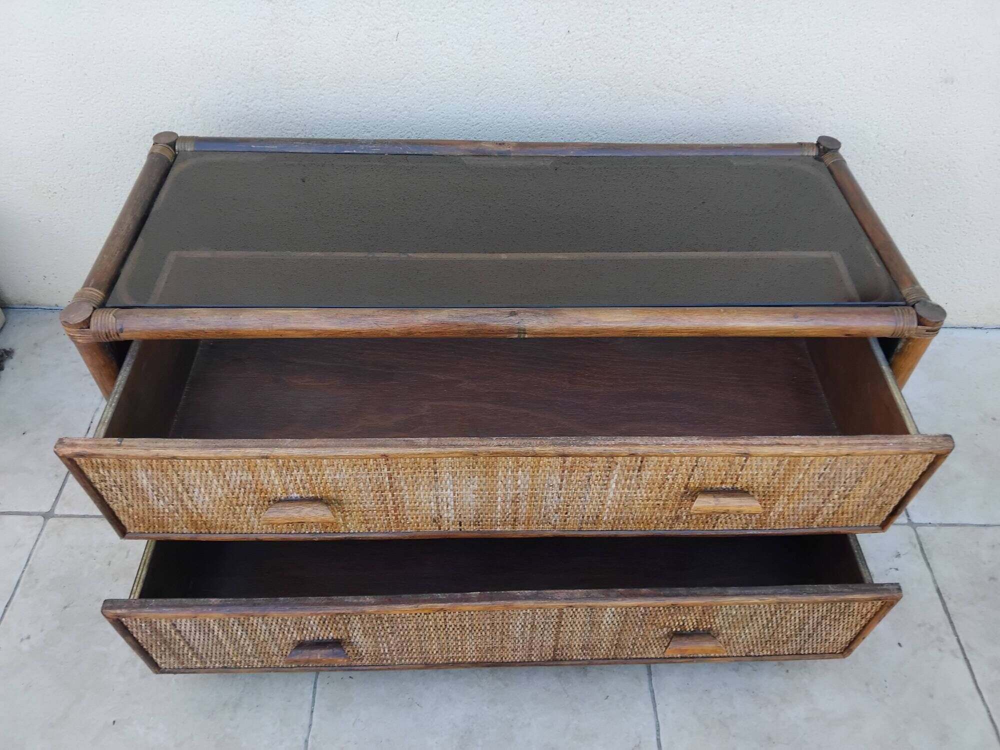 Vintage rattan and glass TV unit.