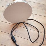 Bronze floor lamp with pine cone decoration.