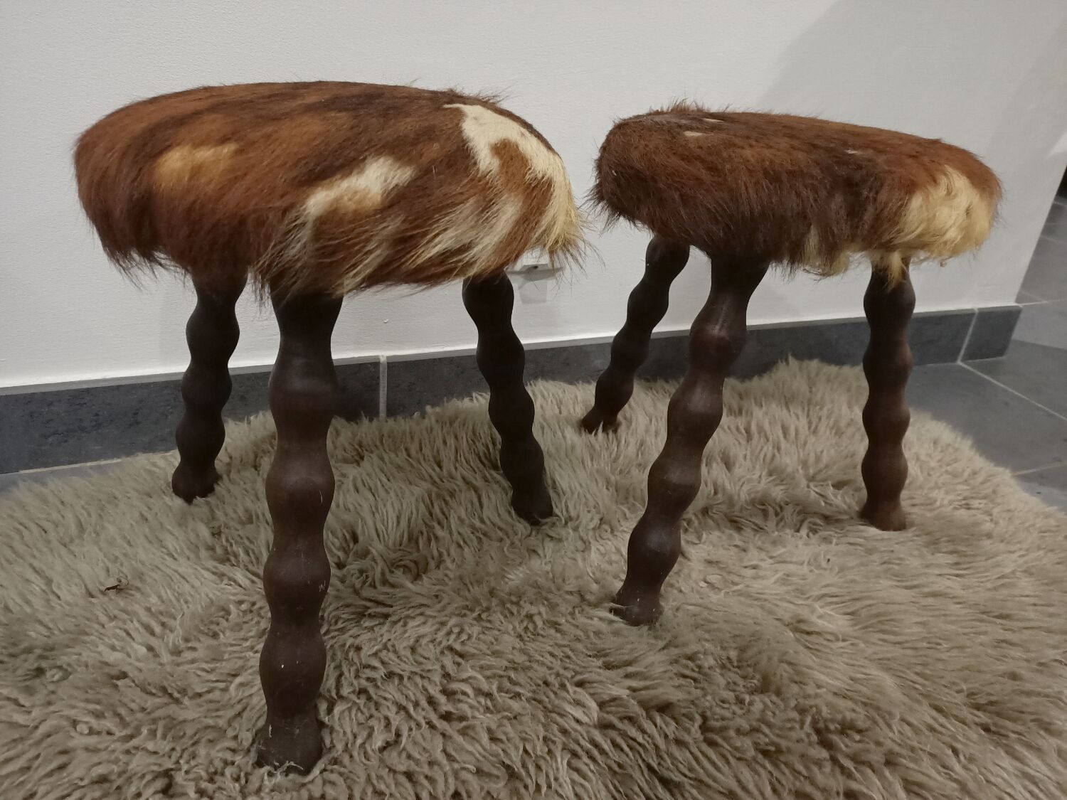 Duo of cowhide stools