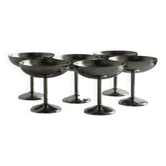 6 standing cups in solid raw stainless steel, France.