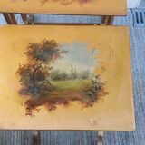 Sets of three nesting tables with painted landscape decorations in poplar.