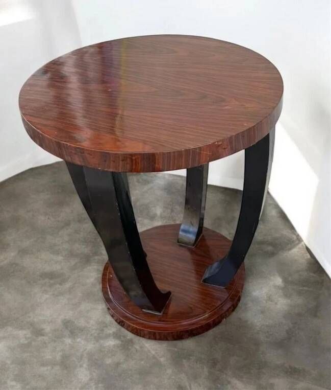 A round Art Deco coffee table made of beech wood and rosewood.