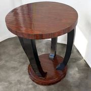 A round Art Deco coffee table made of beech wood and rosewood.
