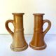 Pair of bohemian sandstone candle holders