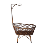Vintage rattan cradle with its spire