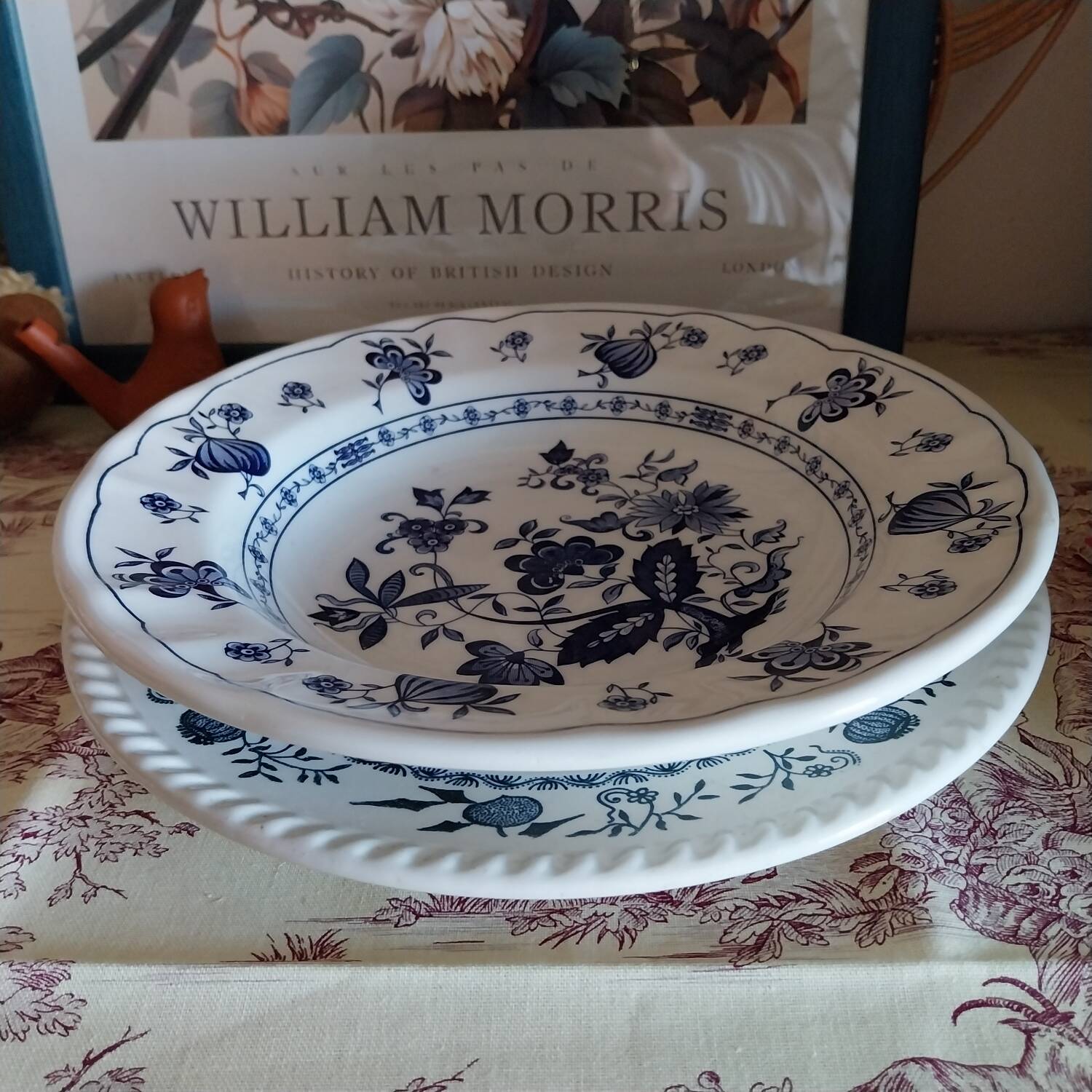 Old plates with blue floral decoration.