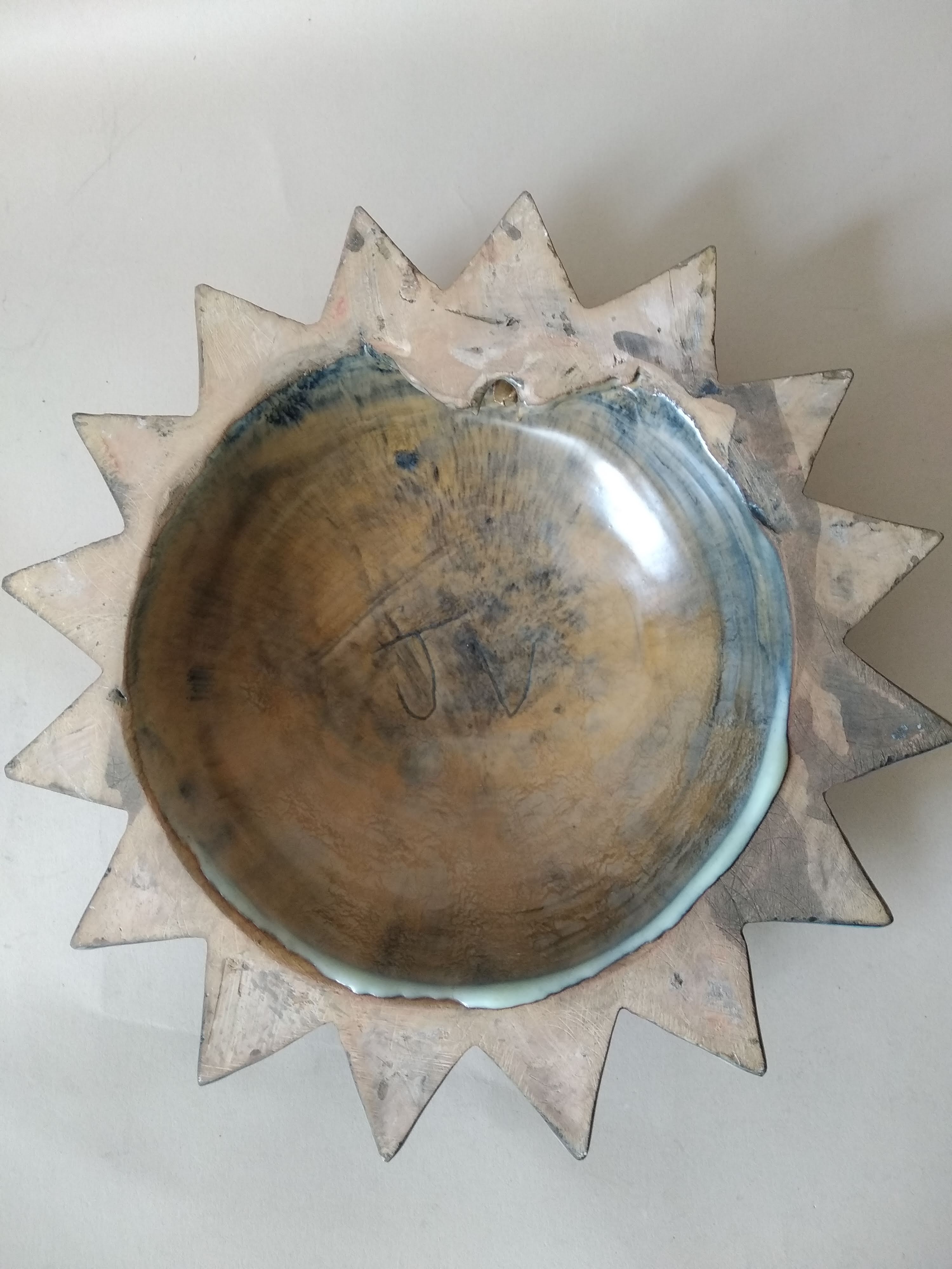 Vintage ceramic sun signed