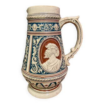 Large pitcher in German sandstone with the profile of bearded character in medallion late nineteenth early twentieth