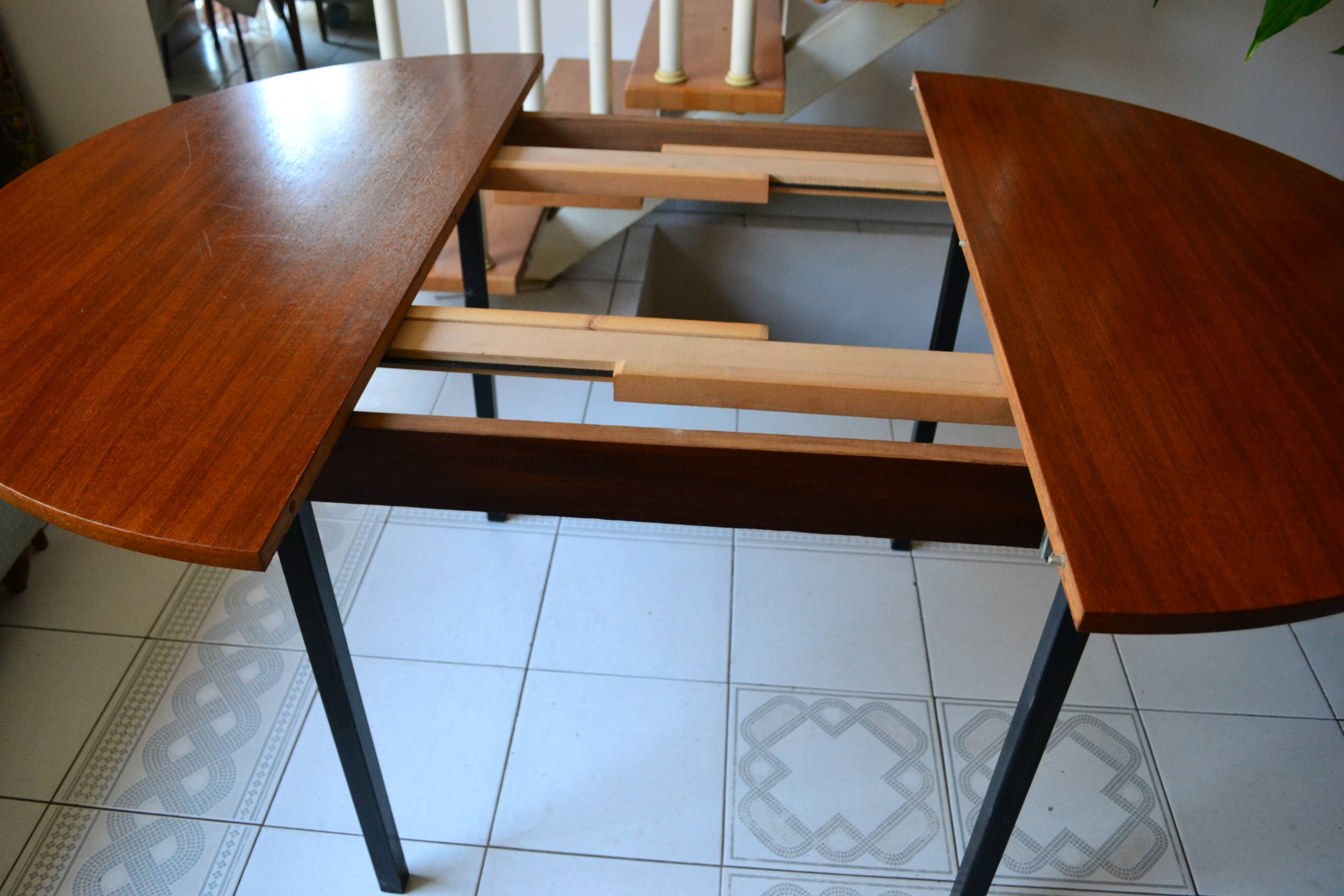 Dining table Pierre Guariche, teak and black steel from the 1960s with extension.