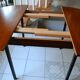 Dining table Pierre Guariche, teak and black steel from the 1960s with extension.