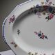 Plat de service Bernardaud porcelaine de Limoges décor floral années 20-50