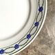 Round dish St Amand in enamelled iron earth white, blue and green