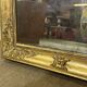19th-century mirror in gilded wood and plaster.