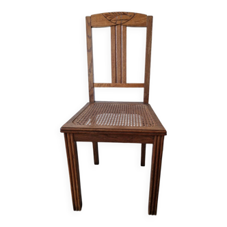 Wooden and cane chair. Carved wooden chair with cane seat.