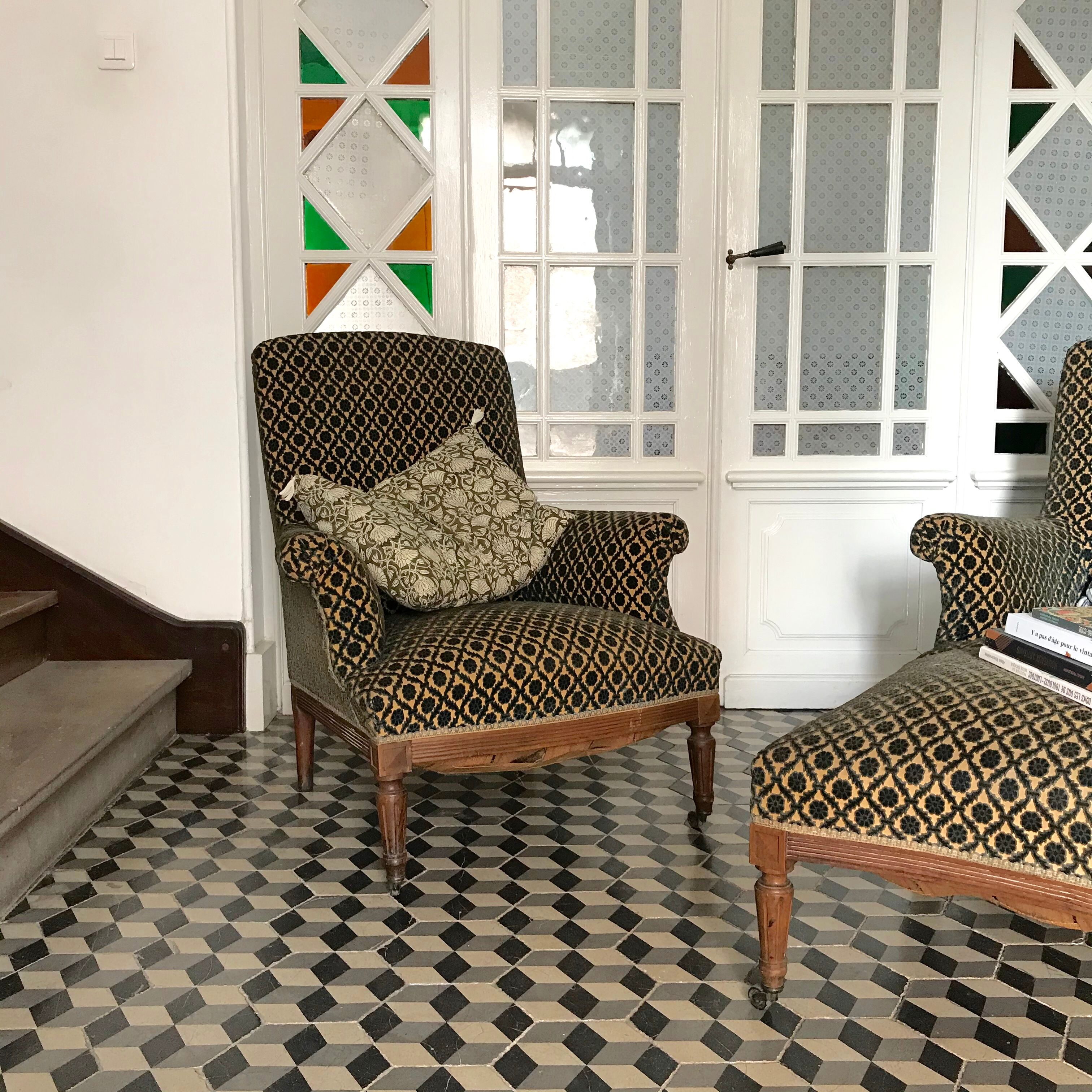 Vintage armchairs and rests feet