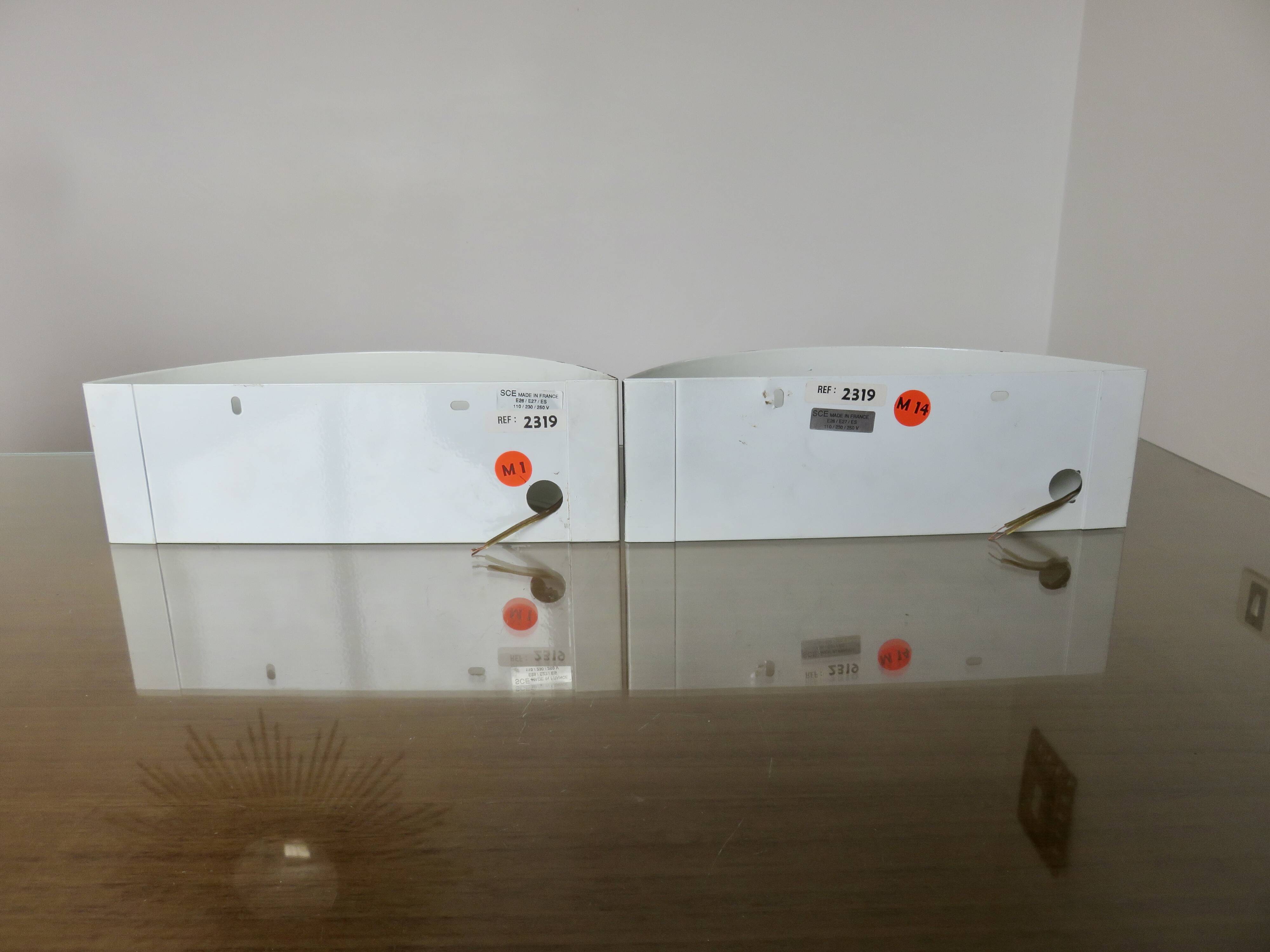 Pair of "SCE" half-moon-shaped band sconces 1980