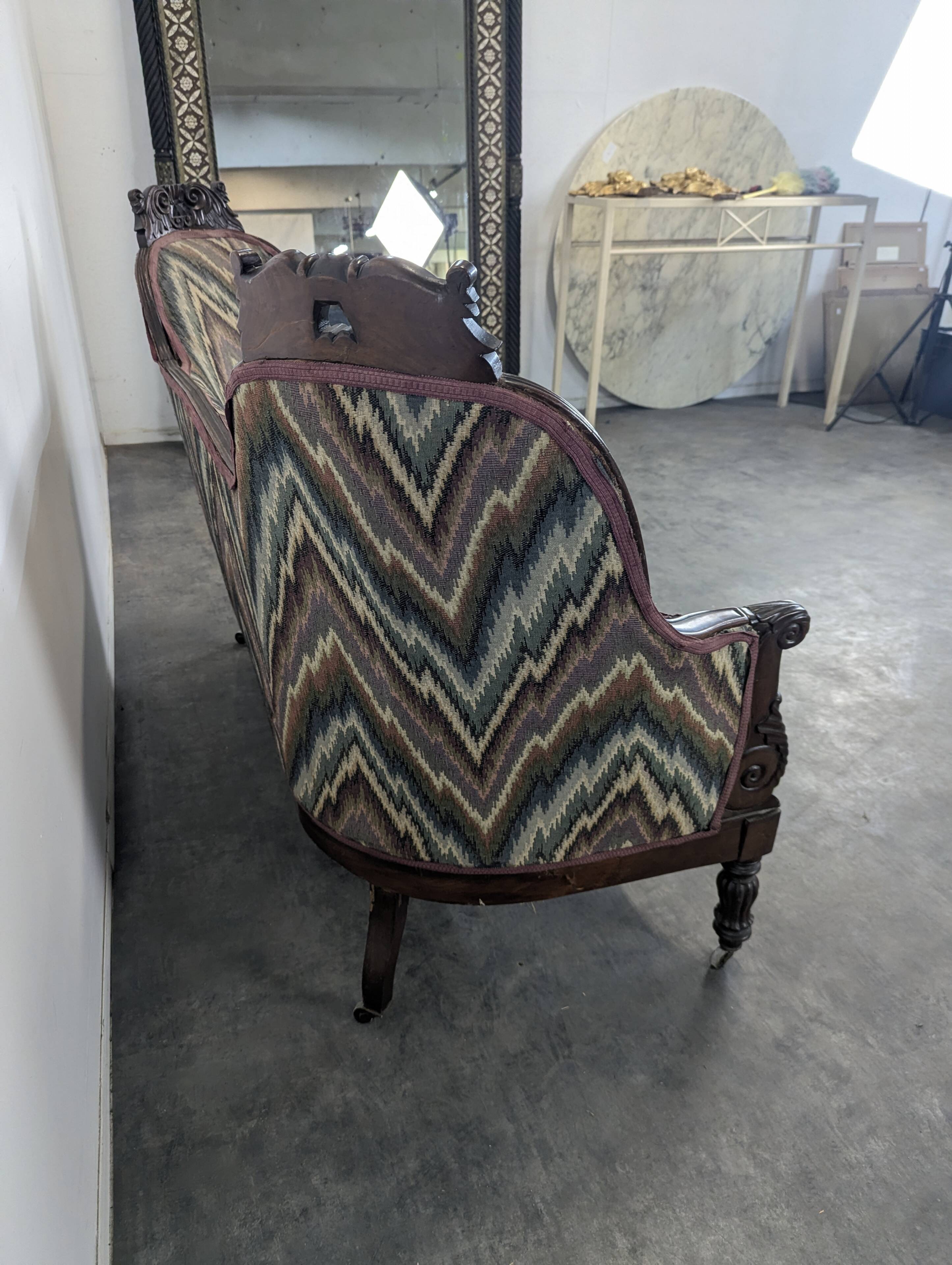 Mahogany banquette sofa in Louis Philippe style.