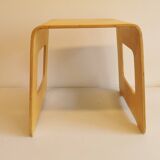 Design stool/side table made of curved plywood.