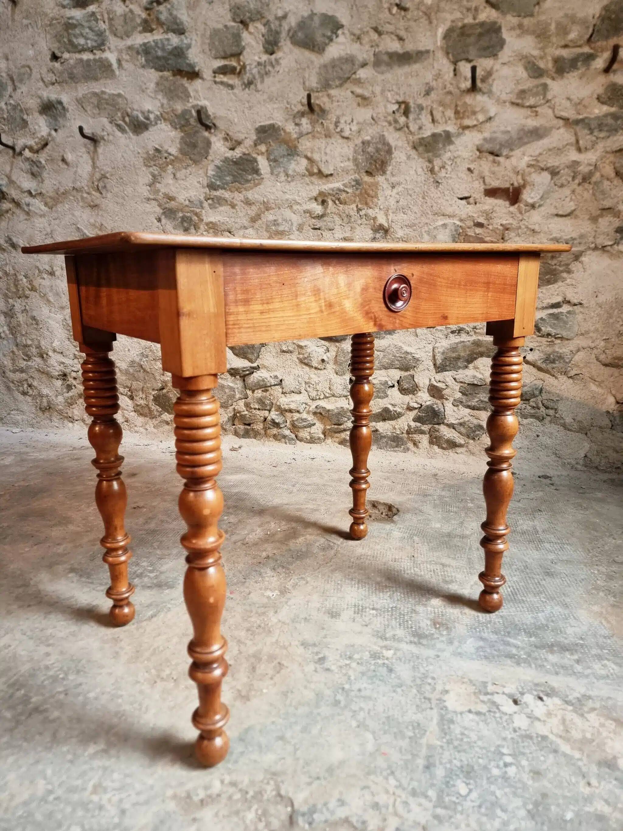 Small antique French writing table in walnut with a drawer, around 1900.