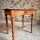 Small antique French writing table in walnut with a drawer, around 1900.