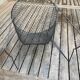 Foldable black woven metal wastepaper basket from around 1950.