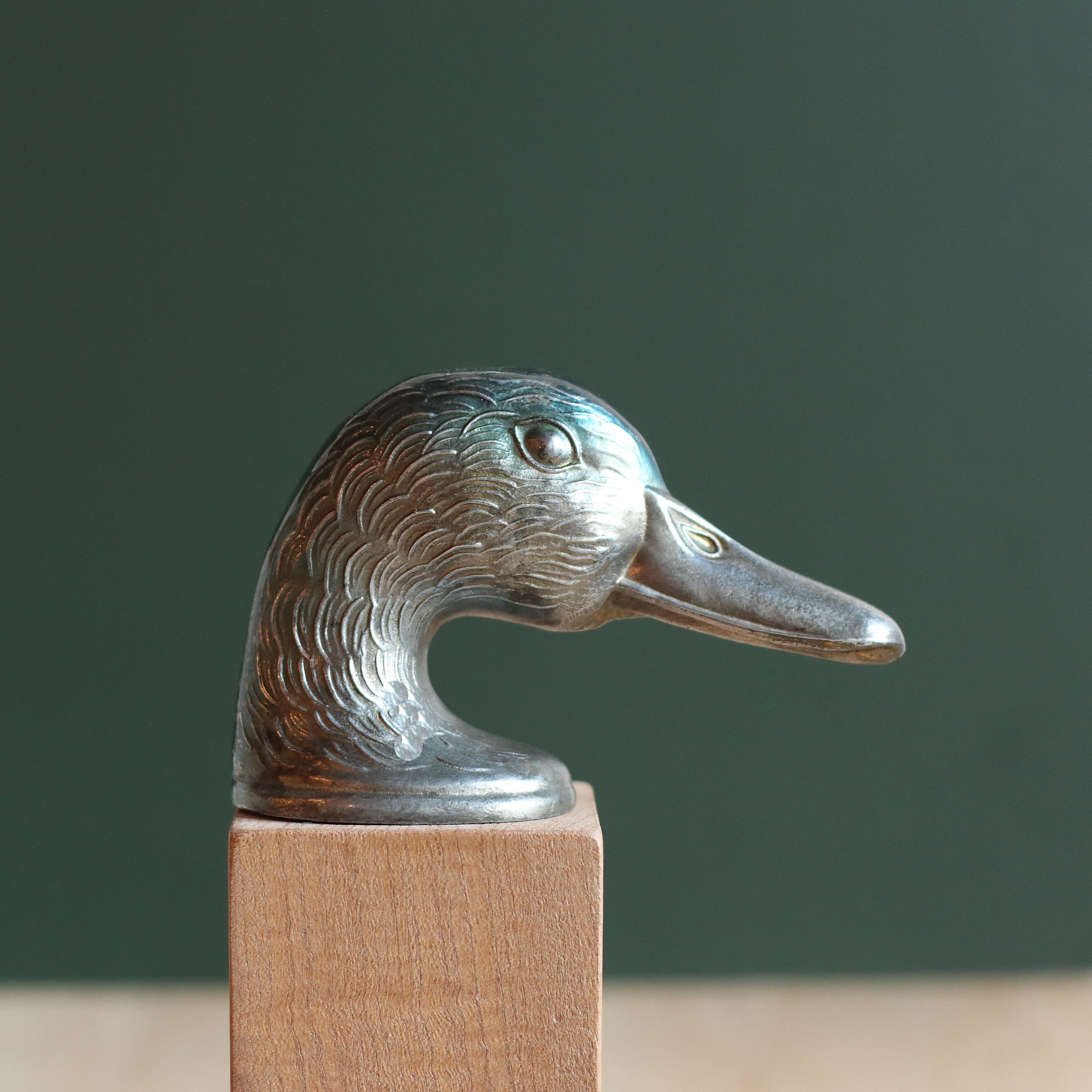 Vintage duck bottle opener signed Ducky in silver metal