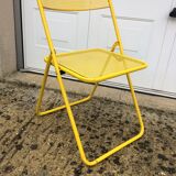 Perforated folding metal chair