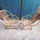 Paire de fauteuils coquille en rotin vintage 1960