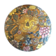 Porcelain candy with enamelled floral decorations. Pretty colors on a golden background.