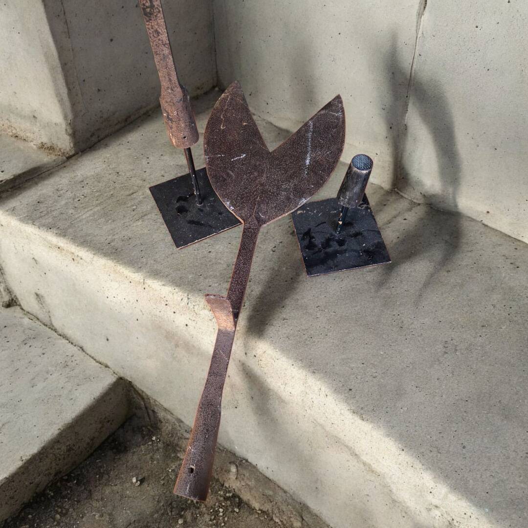 Pair of hay cutters on stands
