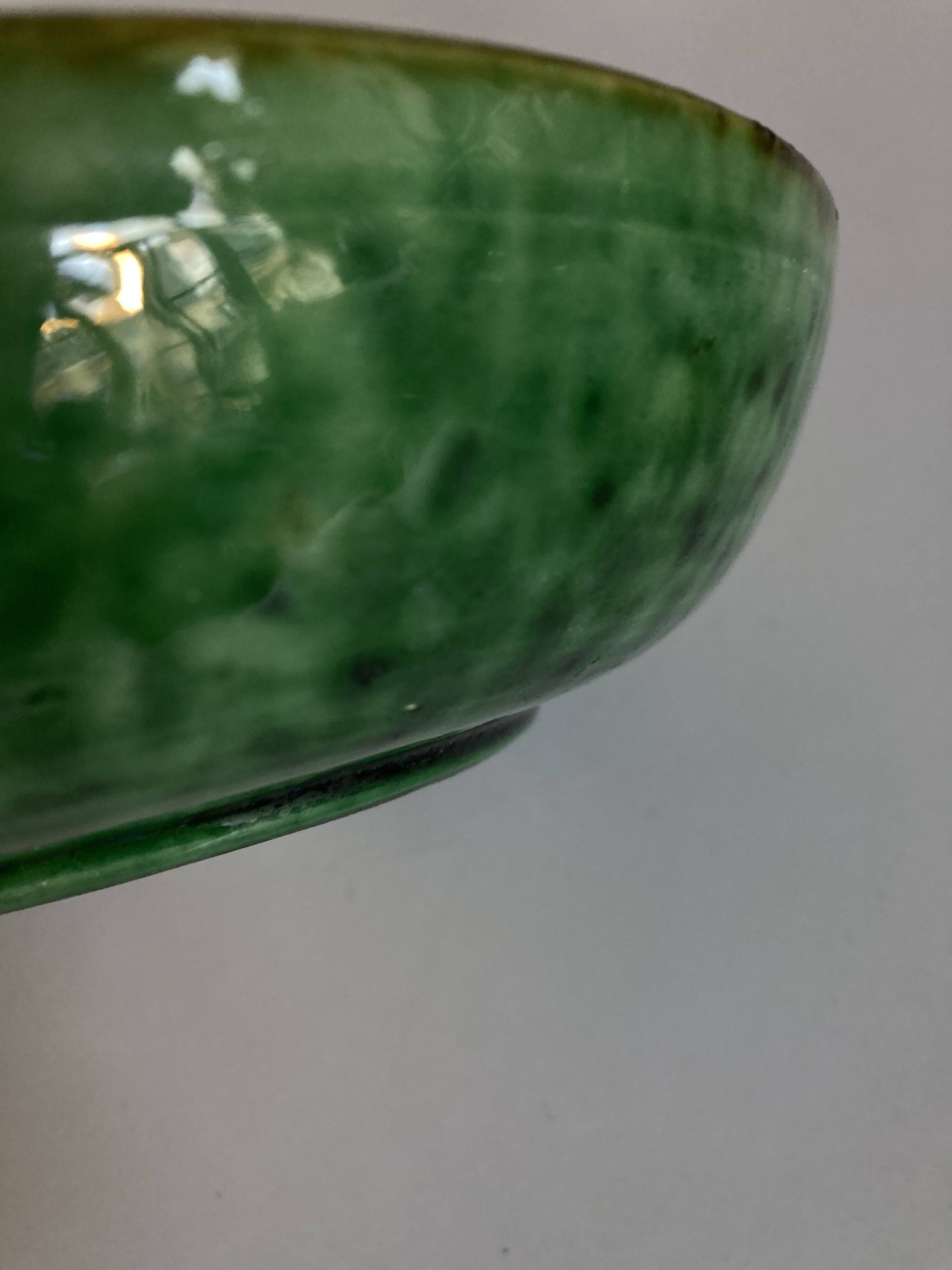 Aegitna hollow dish on heel in green glazed earthenware