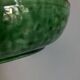 Shallow dish Aegitna on a green glazed earthenware base