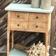 Raw wood console in water green with 4 drawers.