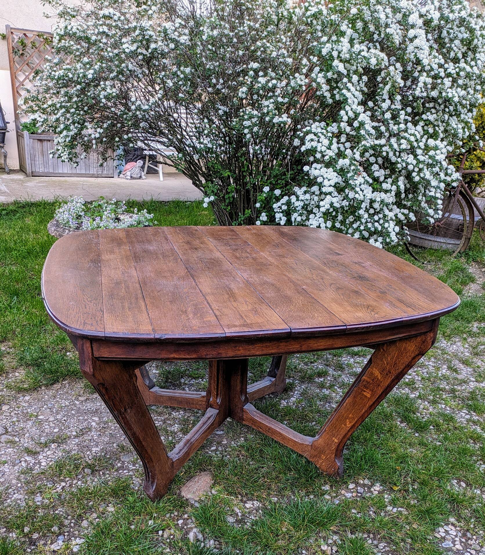 Antique Art Deco table with Eiffel-style legs in solid oak