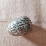 Nut cracker in silver metal