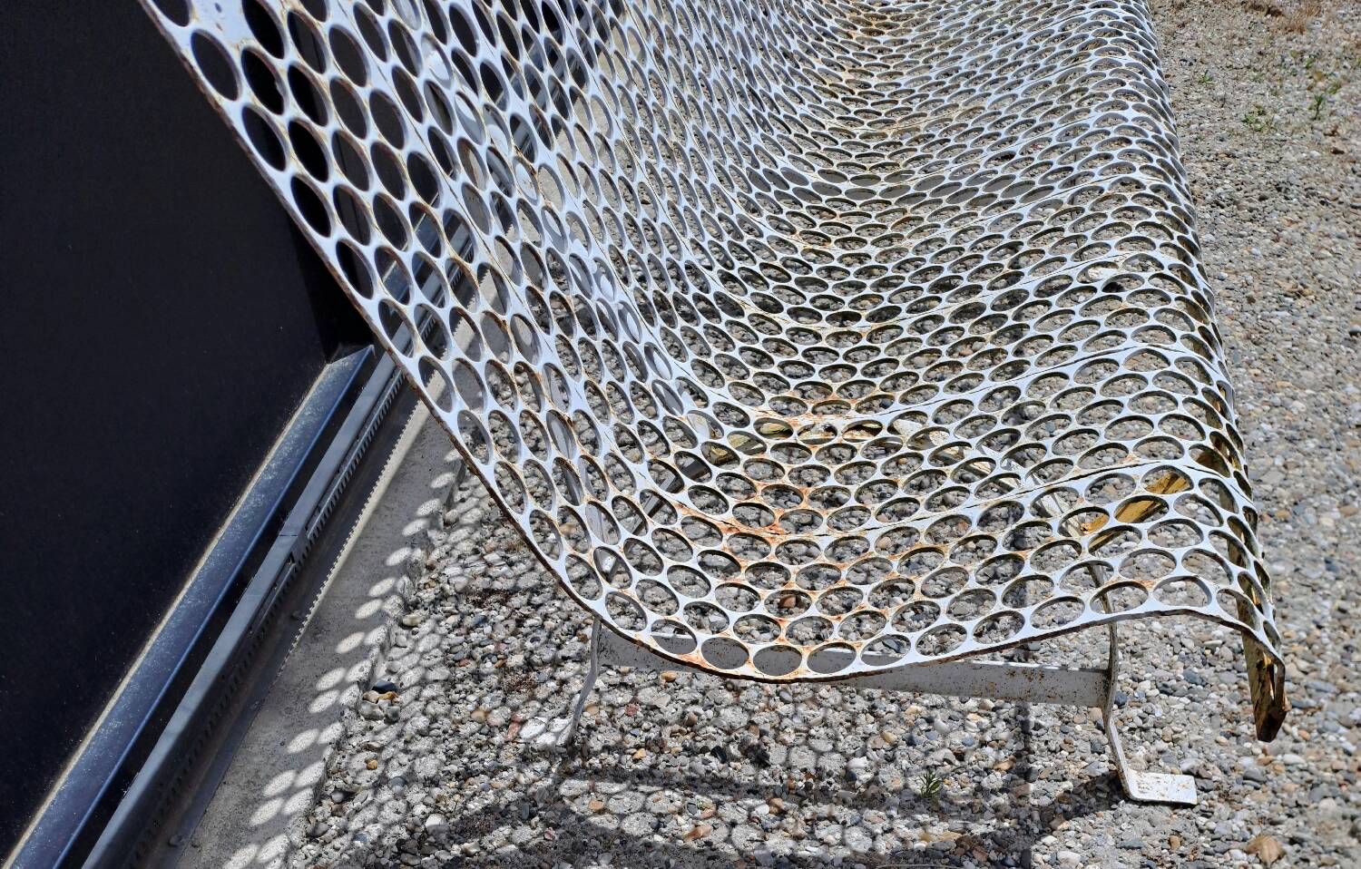 Garden bench in iron and perforated sheet metal
