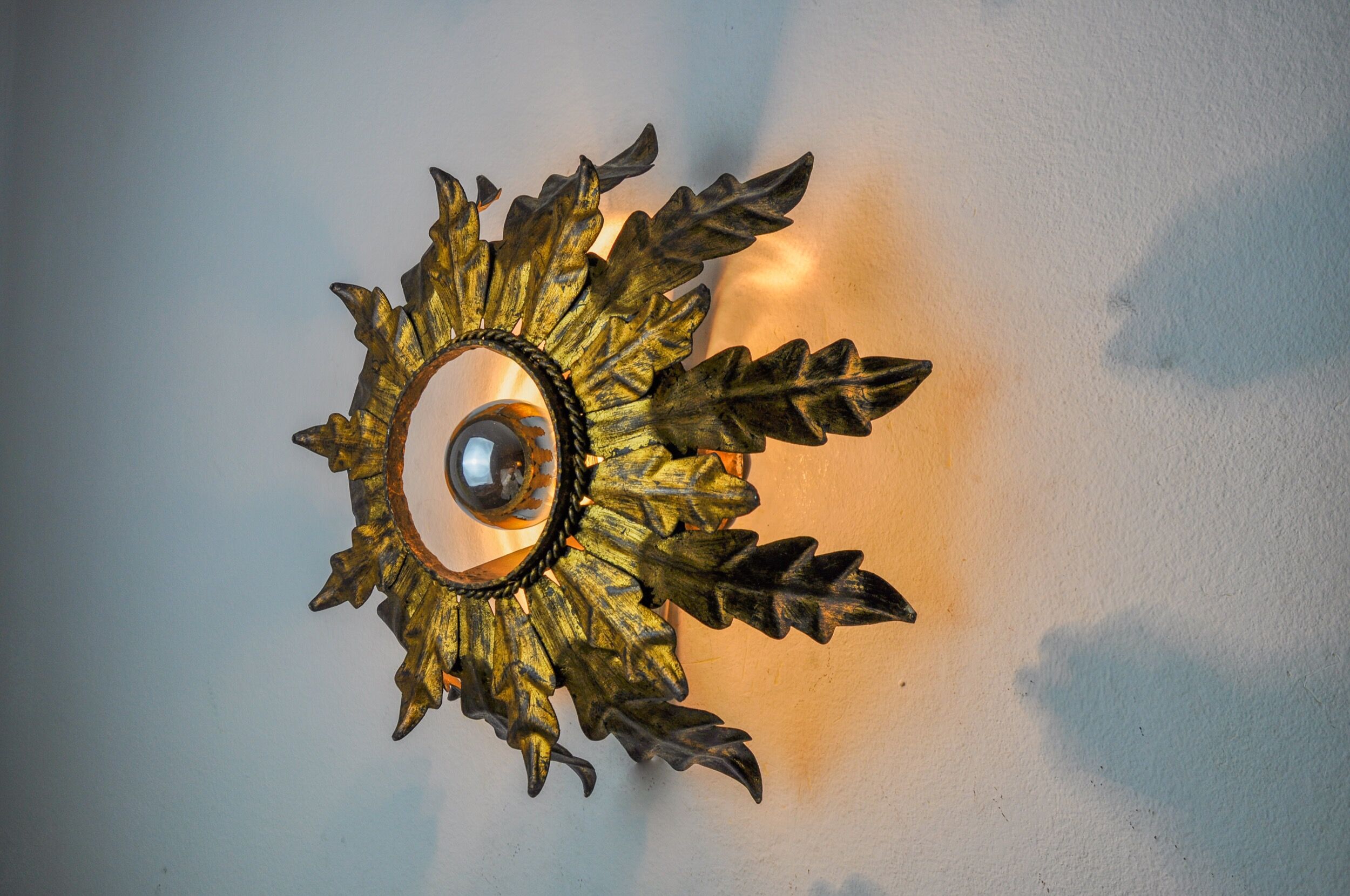 Sun wall lamp by ferro arte, metal and gold leaf, Spain, 1960