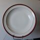 Round hollow serving plate in porcelain from Chastagner et Cie in good condition.