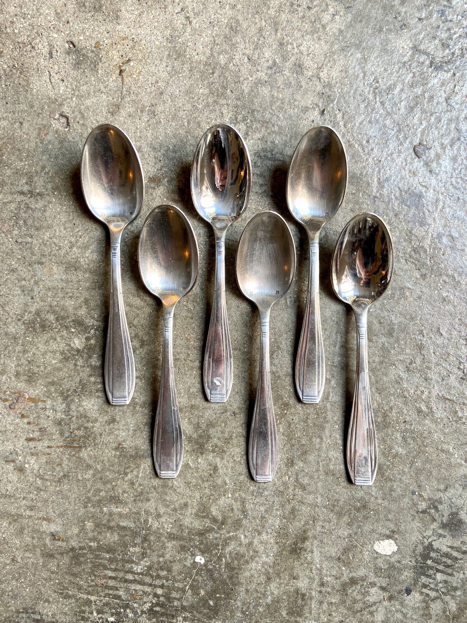 6 silver metal spoons
